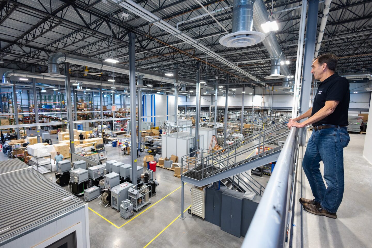 Bluefors Syracuse President, Rich Dausman, looks over manufacturing expansion interior.