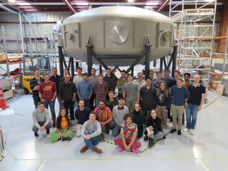 OpenStar Technologies team with the vacuum chamber of the LDR.